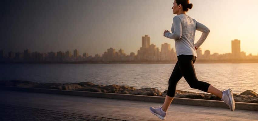 Runner demonstrating proper form to illustrate How to Stop Overstriding Running