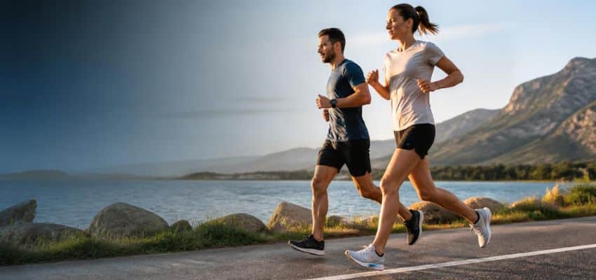 Two runners on a scenic road illustrating Is Heel Striking Bad for Runners
