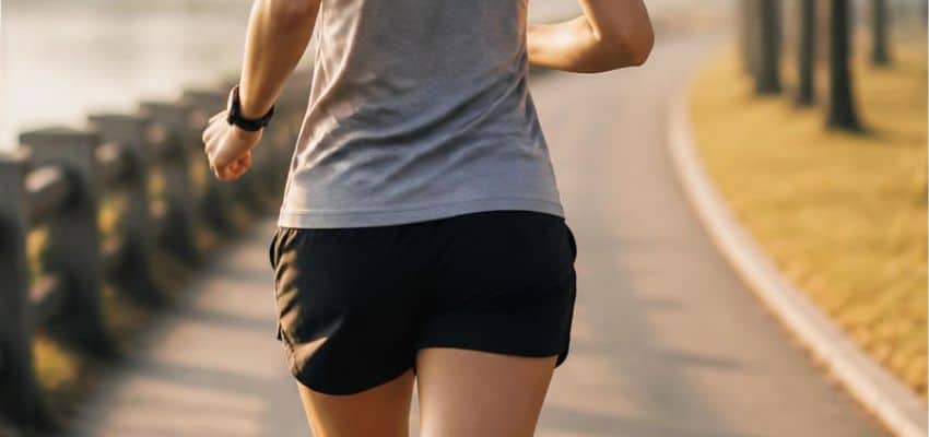 Runner maintaining good posture while running with a focus on Posture Corrector While Running